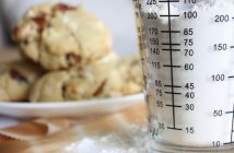 clear glass measuring cup on white ceramic plate